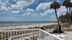 A view of a sandy beach and ocean from a white railed balcony — 1555 TARPON CENTER DRIVE UNIT 262, VENICE, FL