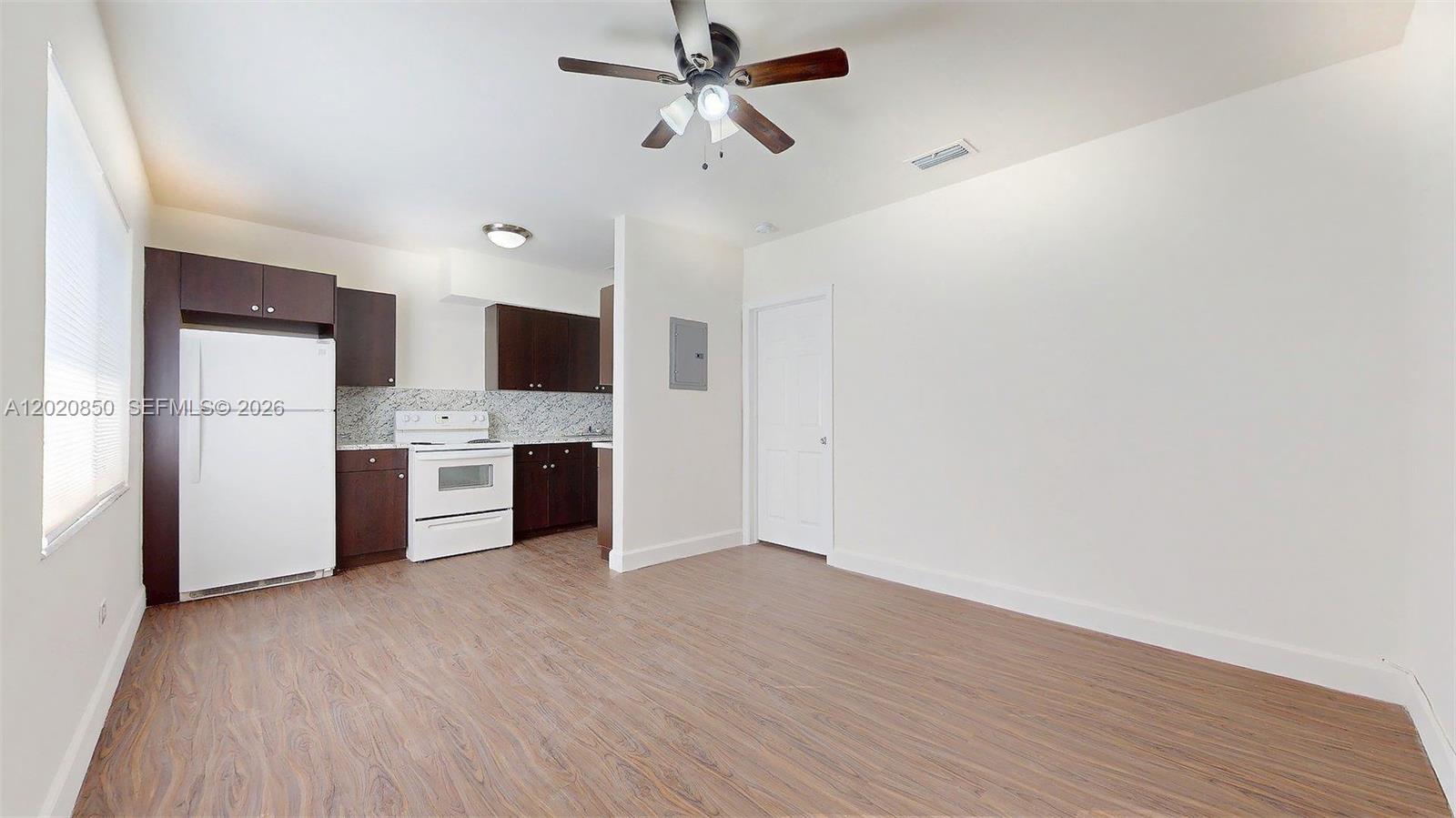 A white exterior wall features a door labeled number two and a sidewalk — 74 W 15th St # 2, Hialeah FL 33010, HIALEAH, FL