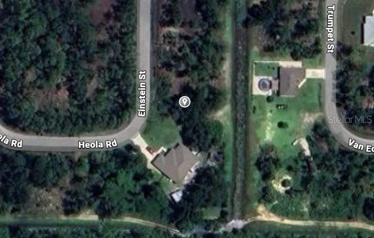 This is an aerial map view showing a residential property located at a street intersection — EINSTEIN STREET, NORTH PORT, FL