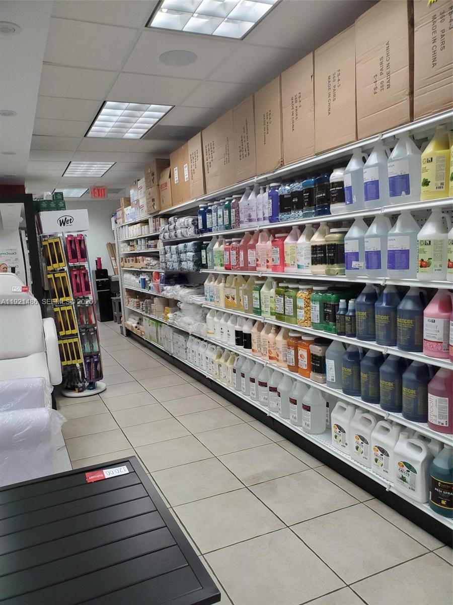 A retail store interior features long shelves stocked with various cleaning and beauty supply products — 7101 SW 8th St, Miami FL 33144, MIAMI, FL
