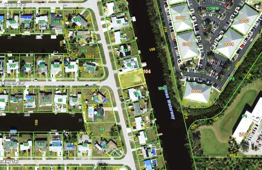 This is a satellite map showing residential lots and a waterway in a suburban neighborhood — 4198 GARDNER DRIVE, PORT CHARLOTTE, FL