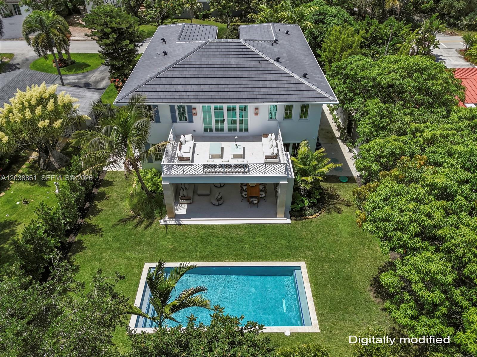 An aerial view shows a two-story house with a pool, patio, and balcony — 6751 SW 76th Ter, South Miami FL 33143, SOUTH MIAMI, FL