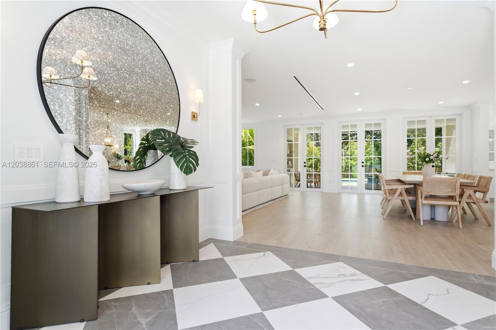 A bright foyer with a checkered marble floor leads into an open-concept living and dining area — 6751 SW 76th Ter, South Miami FL 33143, SOUTH MIAMI, FL
