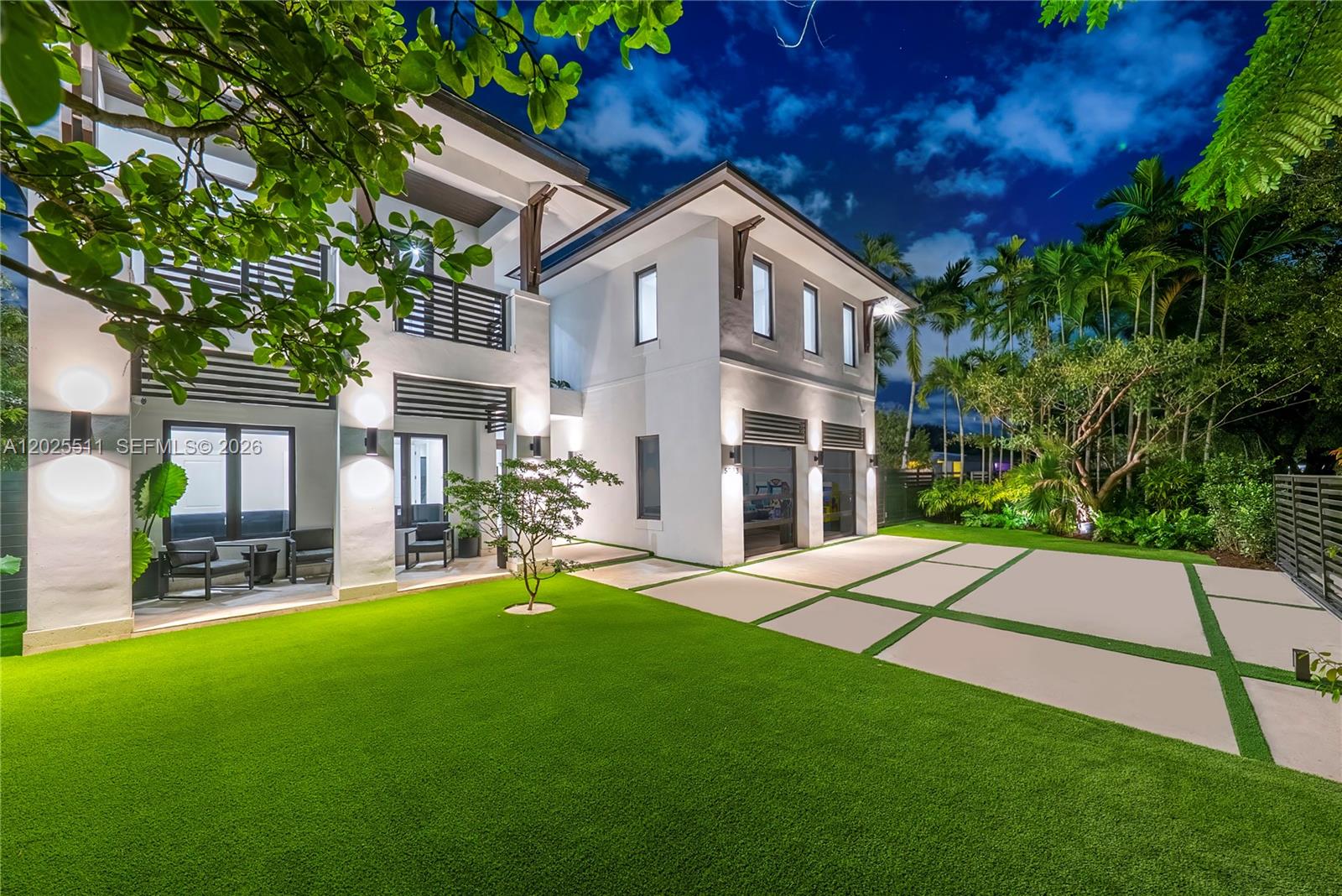 A modern two-story house features a white exterior, a paved driveway, and a green lawn — 5753 SW 31st St, Miami FL 33155, MIAMI, FL
