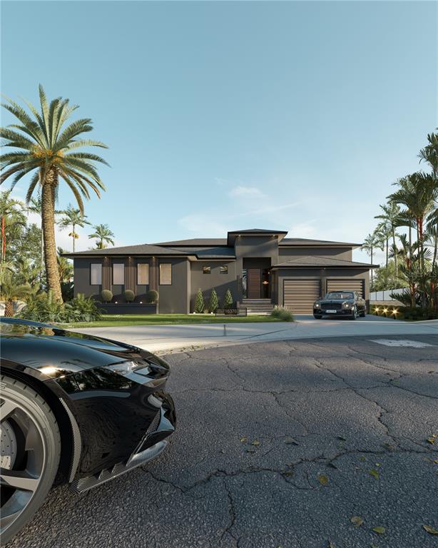 This is a rendering of a modern dark-gray house with a multi-car garage — 16376 PERICO WAY, PUNTA GORDA, FL