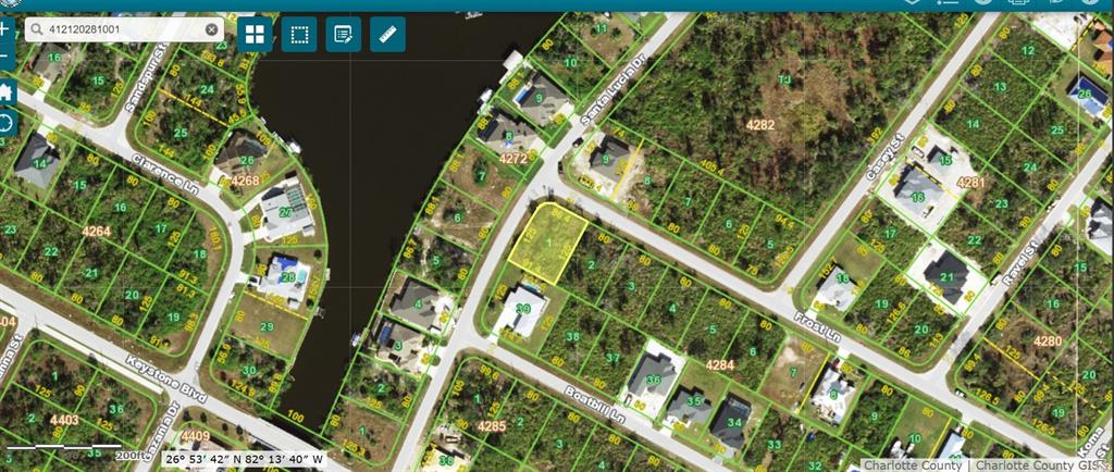 This is a satellite map view of a residential neighborhood with vacant and developed lots — 13463 FROST LANE, PORT CHARLOTTE, FL