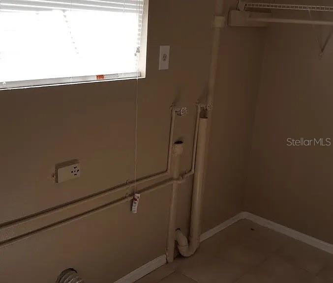 A laundry room with washer hookups, a drain pipe, and a window with blinds — 1235 MORGAN DRIVE, LAKELAND, FL