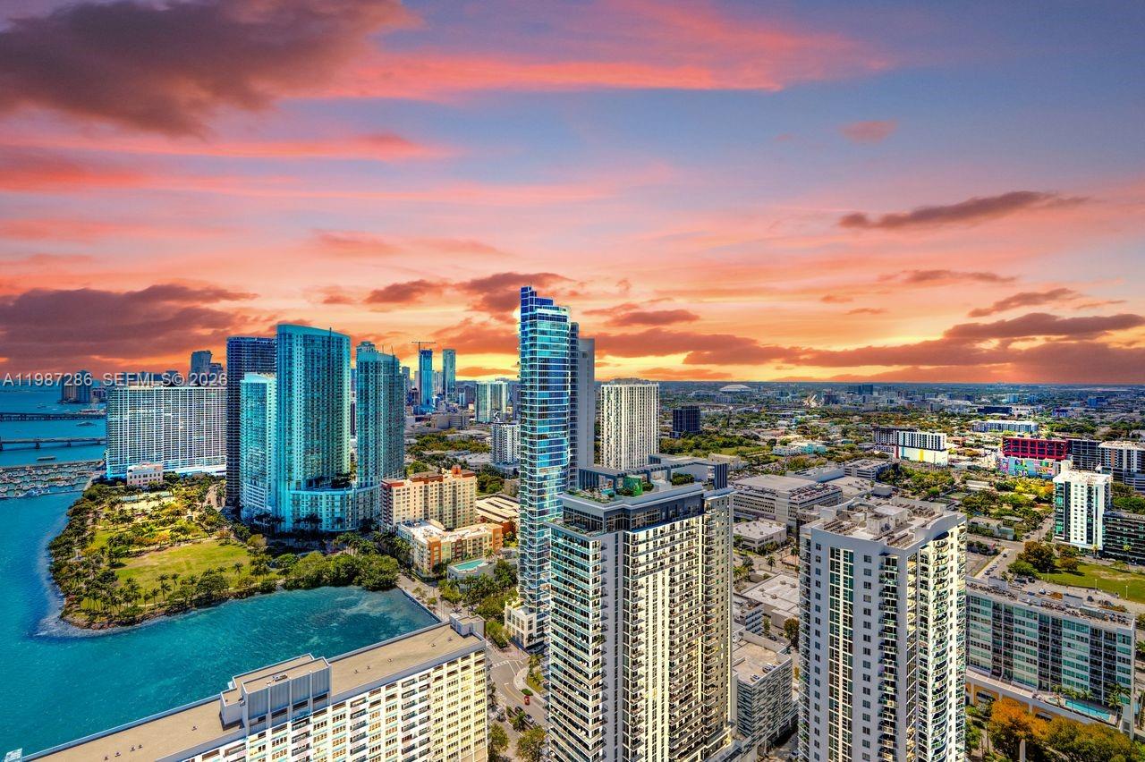 An aerial view of a Miami waterfront cityscape featuring high-rise buildings at sunset — 788 NE 23rd St # 3801, Miami FL 33137, MIAMI, FL