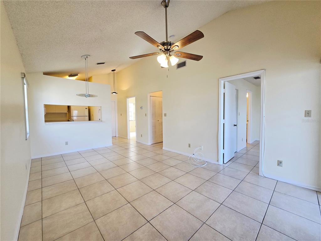 A two-story yellow building with a balcony and a walkway leading to the entrance — 6802 STONES THROW CIRCLE N UNIT 14206, ST PETERSBURG, FL