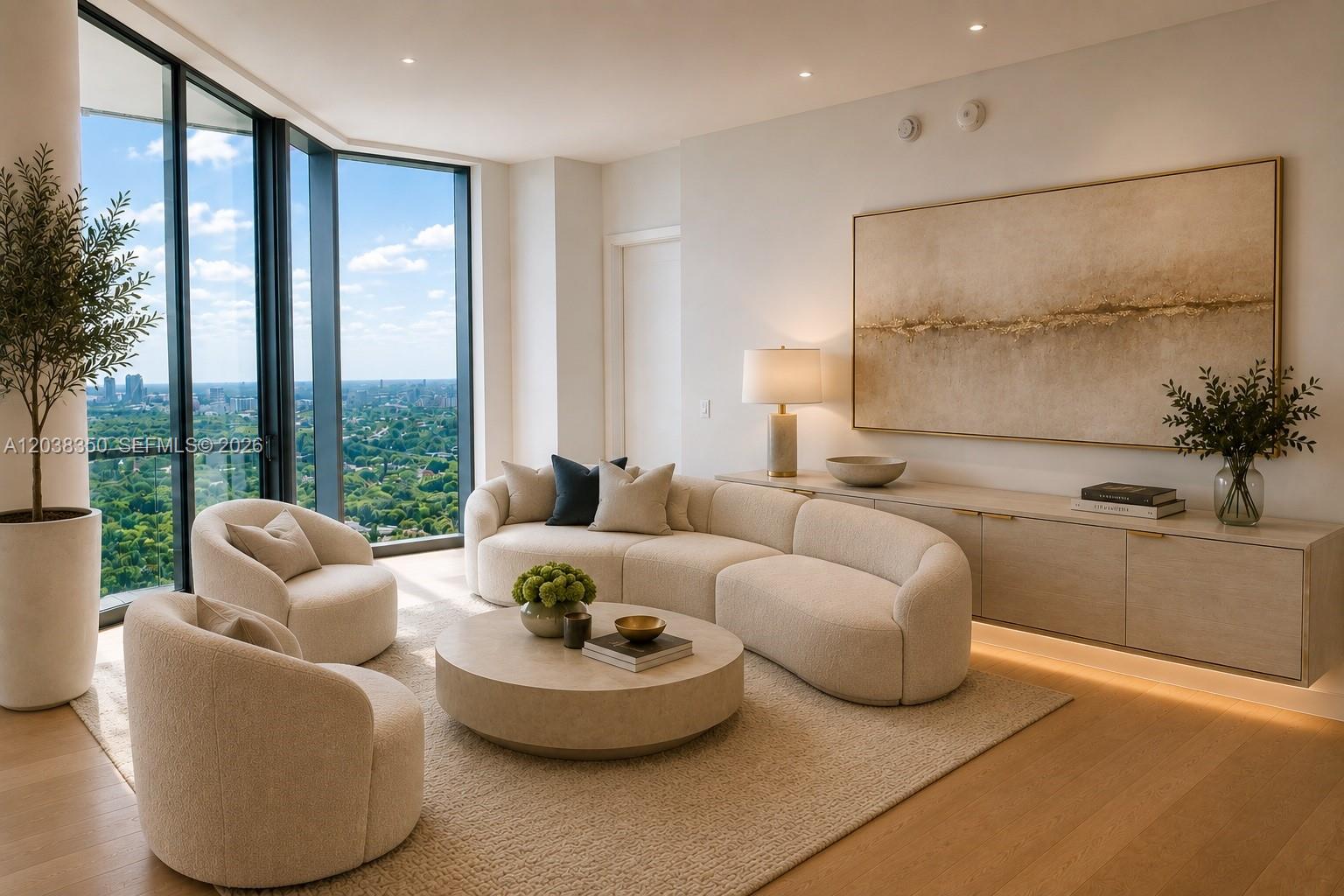 A modern living room features a curved sofa, circular coffee table, and floor-to-ceiling windows — 175 SE 25th Rd # 3103, Miami FL 33129, MIAMI, FL