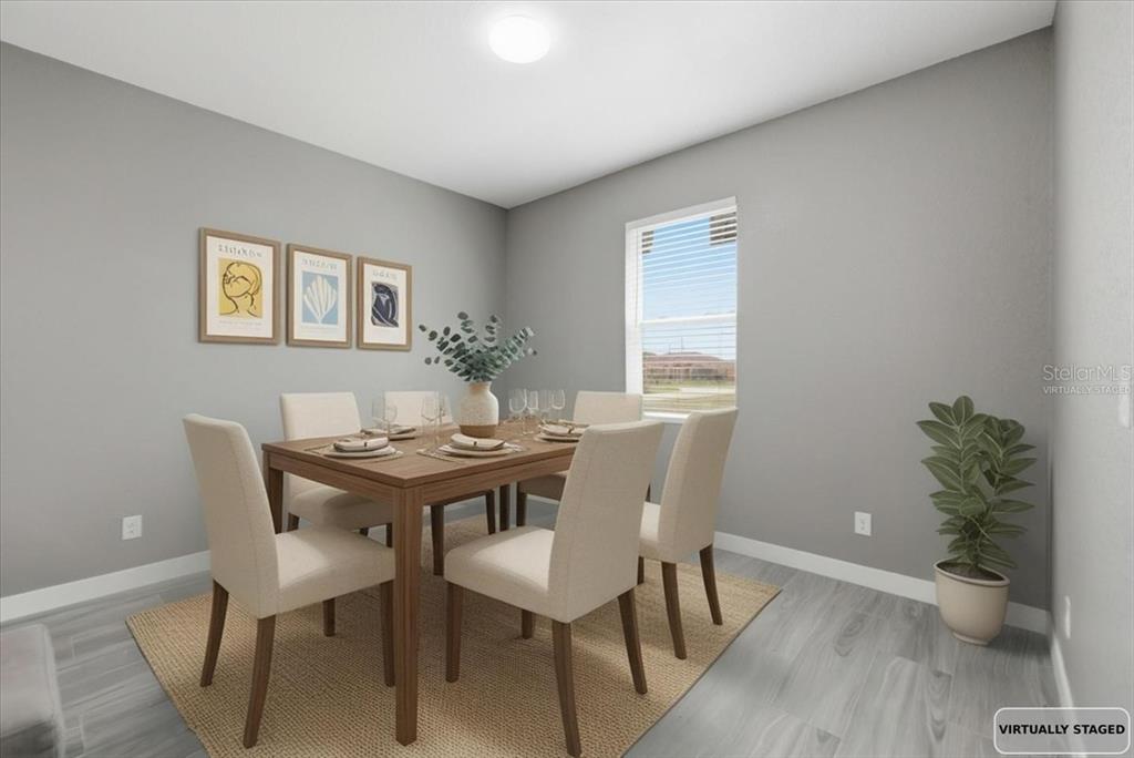 A virtually staged dining room features a wooden table, six chairs, and gray walls — 2683 HOPWOOD ROAD, NORTH PORT, FL