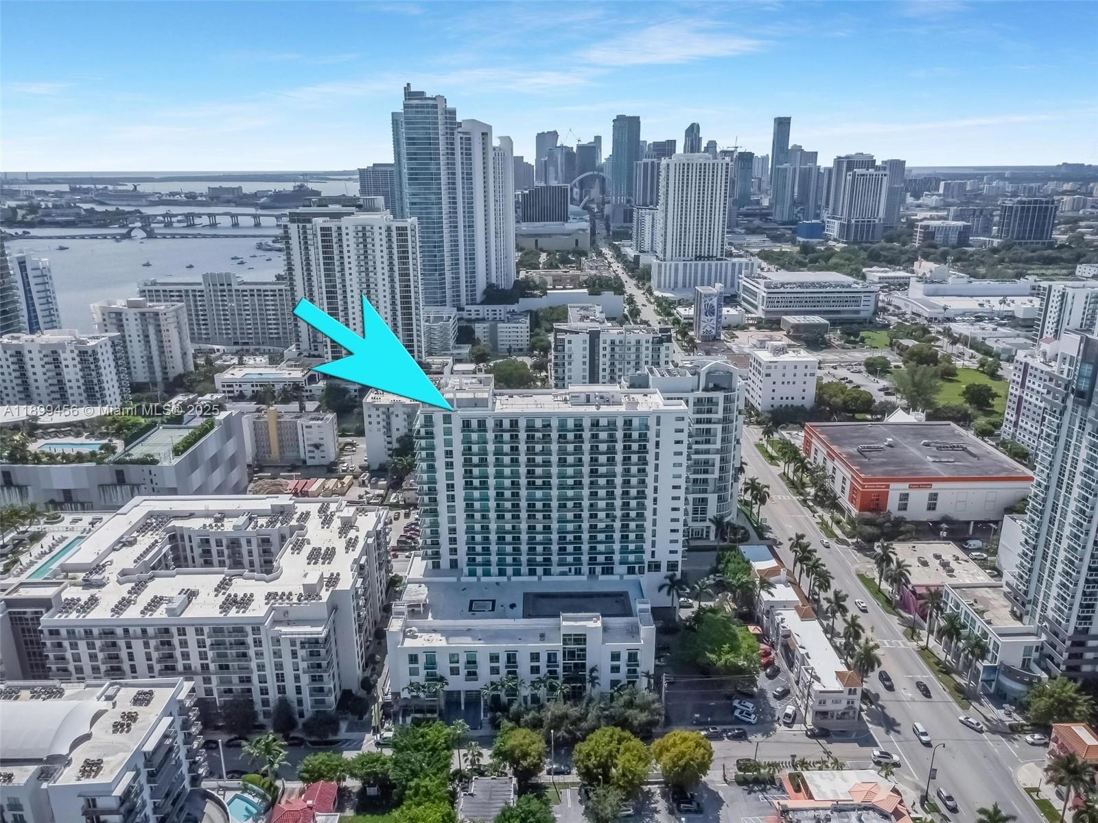 An aerial view of a high-rise residential building in a dense urban city setting — 333 NE 24th St # 812, Miami FL 33137, MIAMI, FL