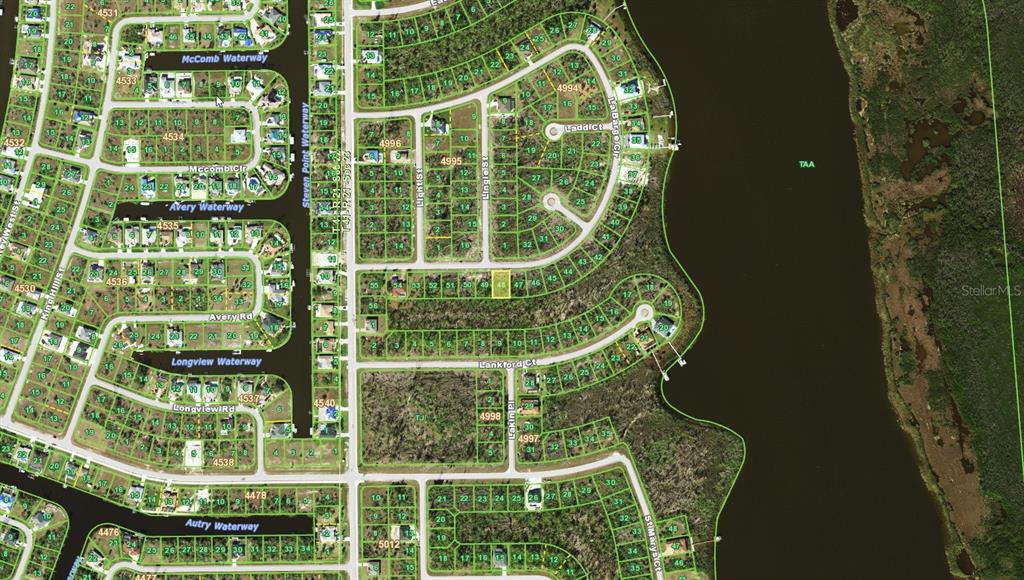 This is an aerial map showing residential lots, waterways, and streets in a suburban neighborhood — 16280 LA BARGE CIRCLE, PORT CHARLOTTE, FL