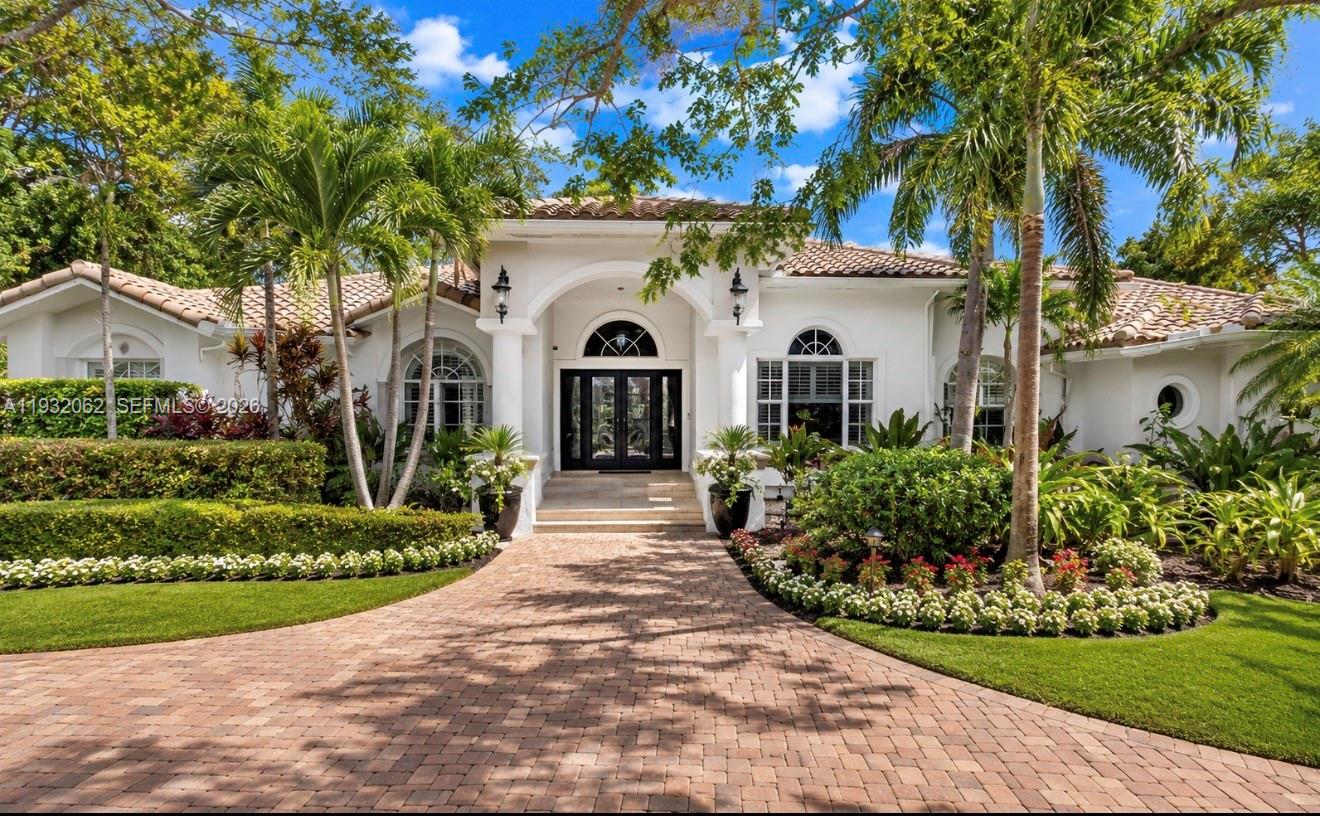 A single-story white house with a tile roof and a brick paver driveway — 11825 S Mitchell Manor Cir, Pinecrest FL 33156, PINECREST, FL