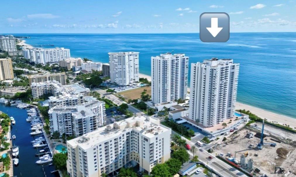 An aerial view of high-rise apartment buildings located along a sandy beach and oceanfront — 1370 S Ocean Blvd # 1506, Pompano Beach FL 33062, POMPANO BEACH, FL