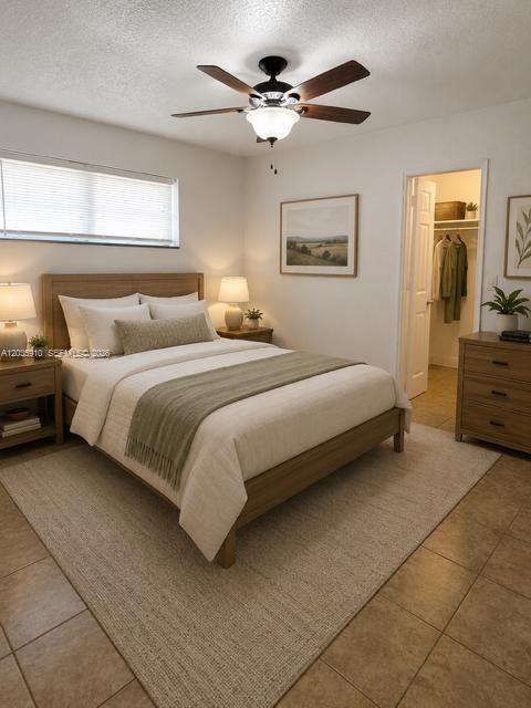 This bedroom features a wooden bed frame, a ceiling fan, and an attached walk-in closet — 356 SW 2nd Pl # 3, Pompano Beach FL 33060, POMPANO BEACH, FL