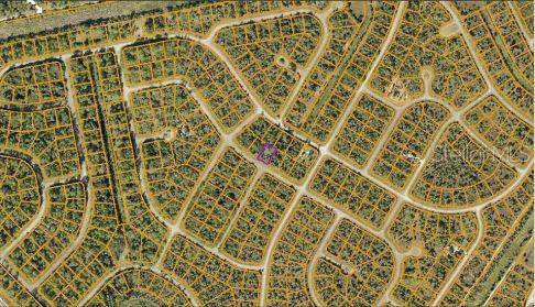 An aerial map view shows a residential neighborhood with a specific lot highlighted in purple — FIREBIRD ROAD, NORTH PORT, FL