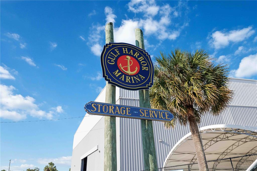 A sign for Gulf Harbor Marina stands on wooden posts in front of a building — 100 CIRCUIT ROAD UNIT N11, NOKOMIS, FL