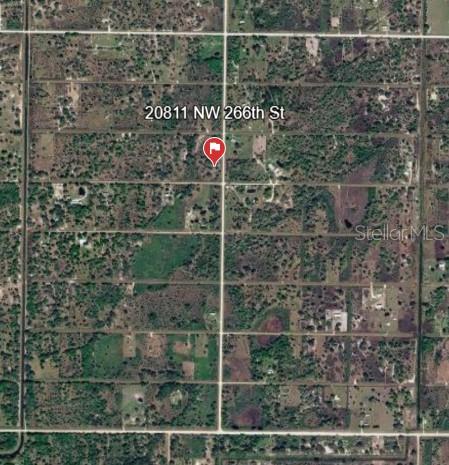 This is an aerial map view showing a rural property with surrounding vegetation and roads — 20811 NW 266TH STREET, OKEECHOBEE, FL
