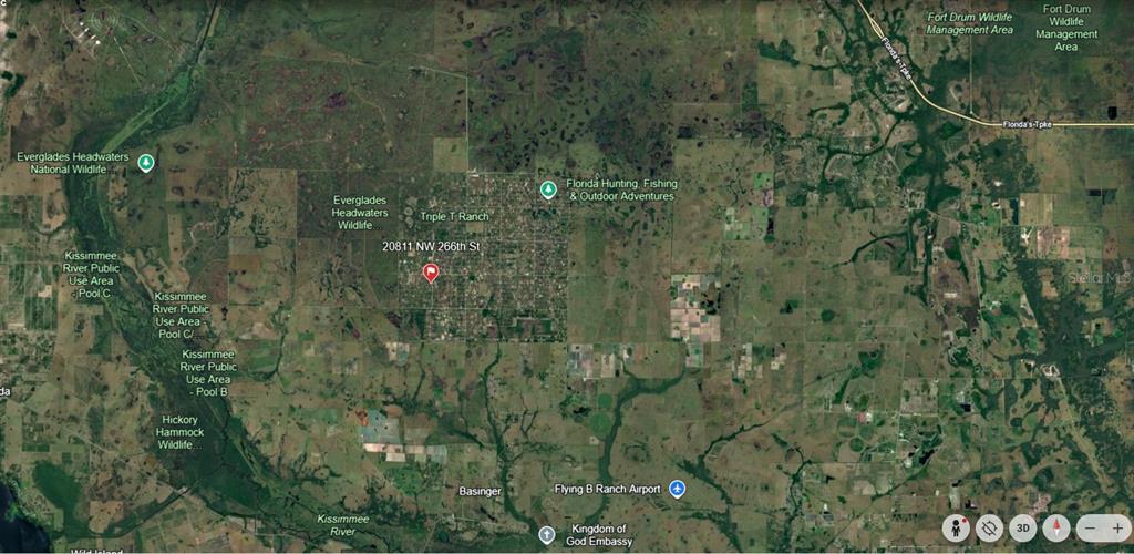 This is a satellite map showing rural land near the Kissimmee River in Florida — 20811 NW 266TH STREET, OKEECHOBEE, FL