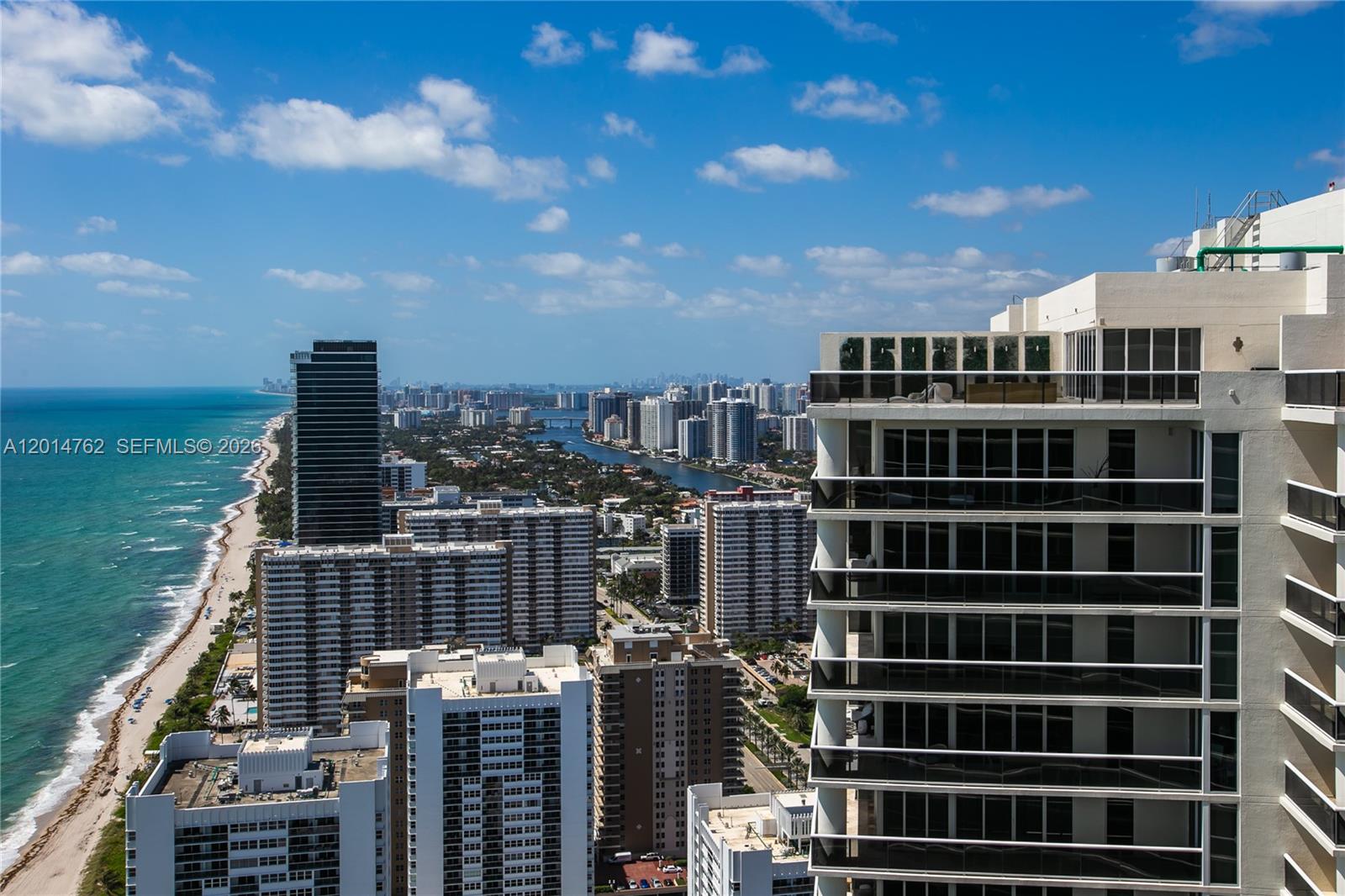 An aerial view shows high-rise buildings along a sandy beach and the ocean — 1830 S Ocean Dr # 4504, Hallandale Beach FL 33009, HALLANDALE BEACH, FL