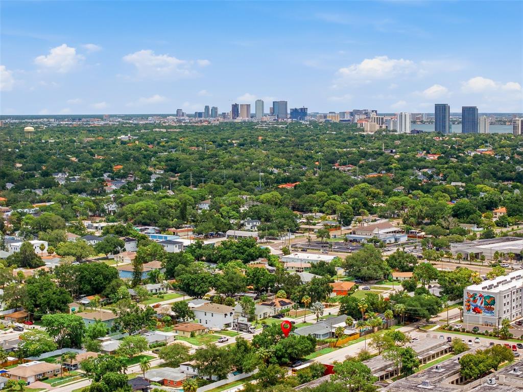 An aerial view shows a residential neighborhood with a red location pin on a house — 4416 W BAY COURT AVE, TAMPA, FL