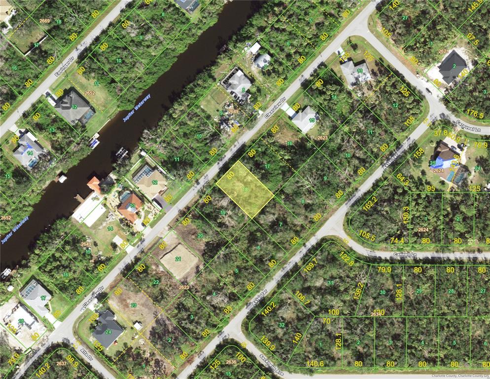 This is a satellite map showing a vacant residential lot highlighted in yellow — 1232 CLEARVIEW DRIVE, PORT CHARLOTTE, FL