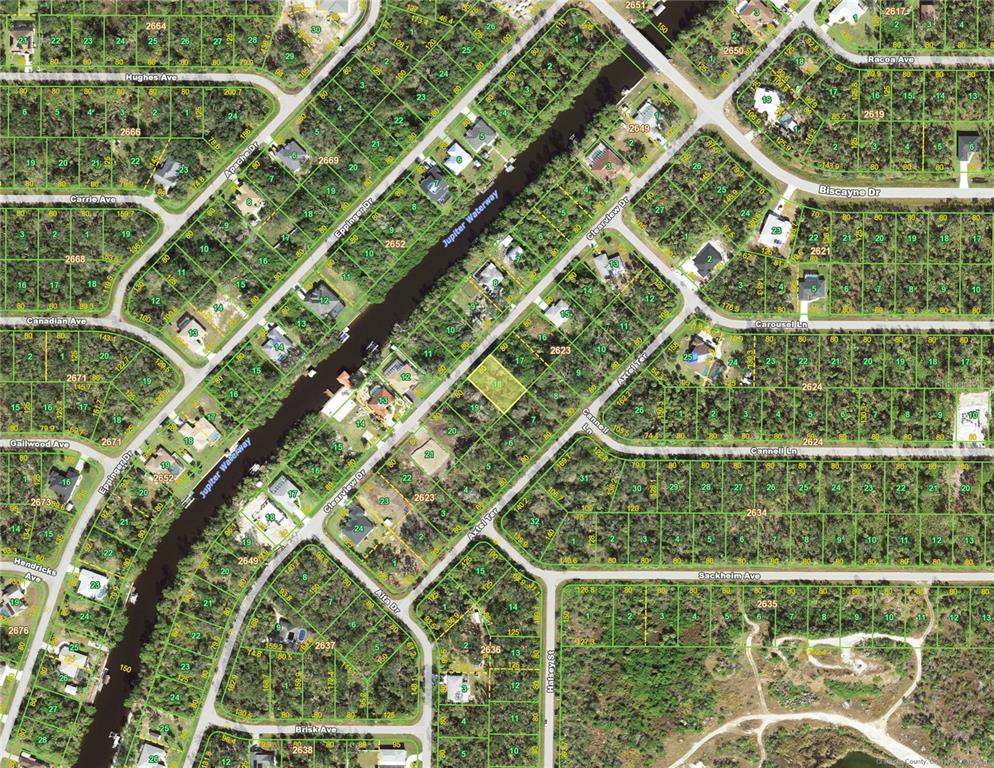 This is an aerial map showing residential lots and a waterway in a suburban neighborhood — 1232 CLEARVIEW DRIVE, PORT CHARLOTTE, FL