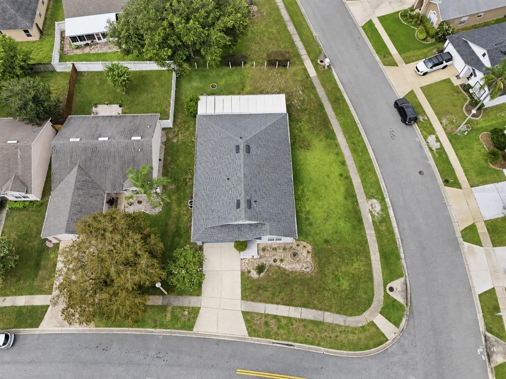 An aerial view shows a residential house with a gray roof and a concrete driveway — 2512 ABACUS COURT, LAKE MARY, FL