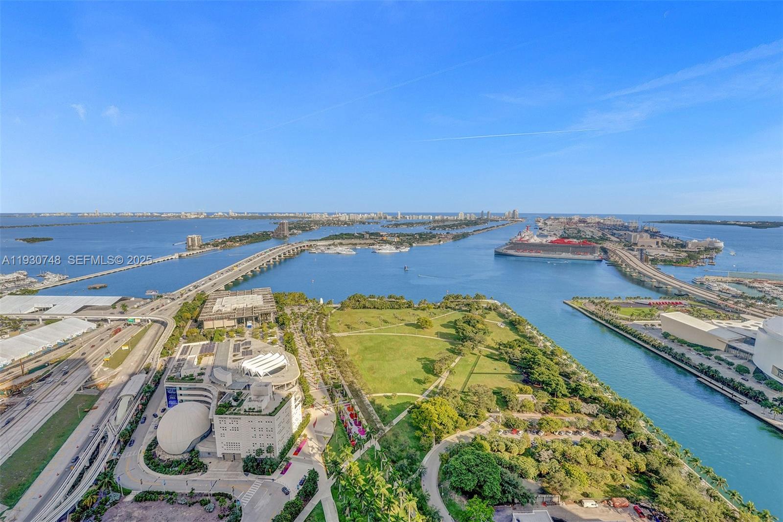 An aerial view shows a park, a museum, bridges, and cruise ships in Miami — 1000 Biscayne Blvd # 3902, Miami FL 33132, MIAMI, FL