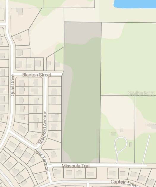This map shows a large, undeveloped rectangular parcel of land bordered by residential streets — 2130 MISSOULA TRAIL, DELTONA, FL