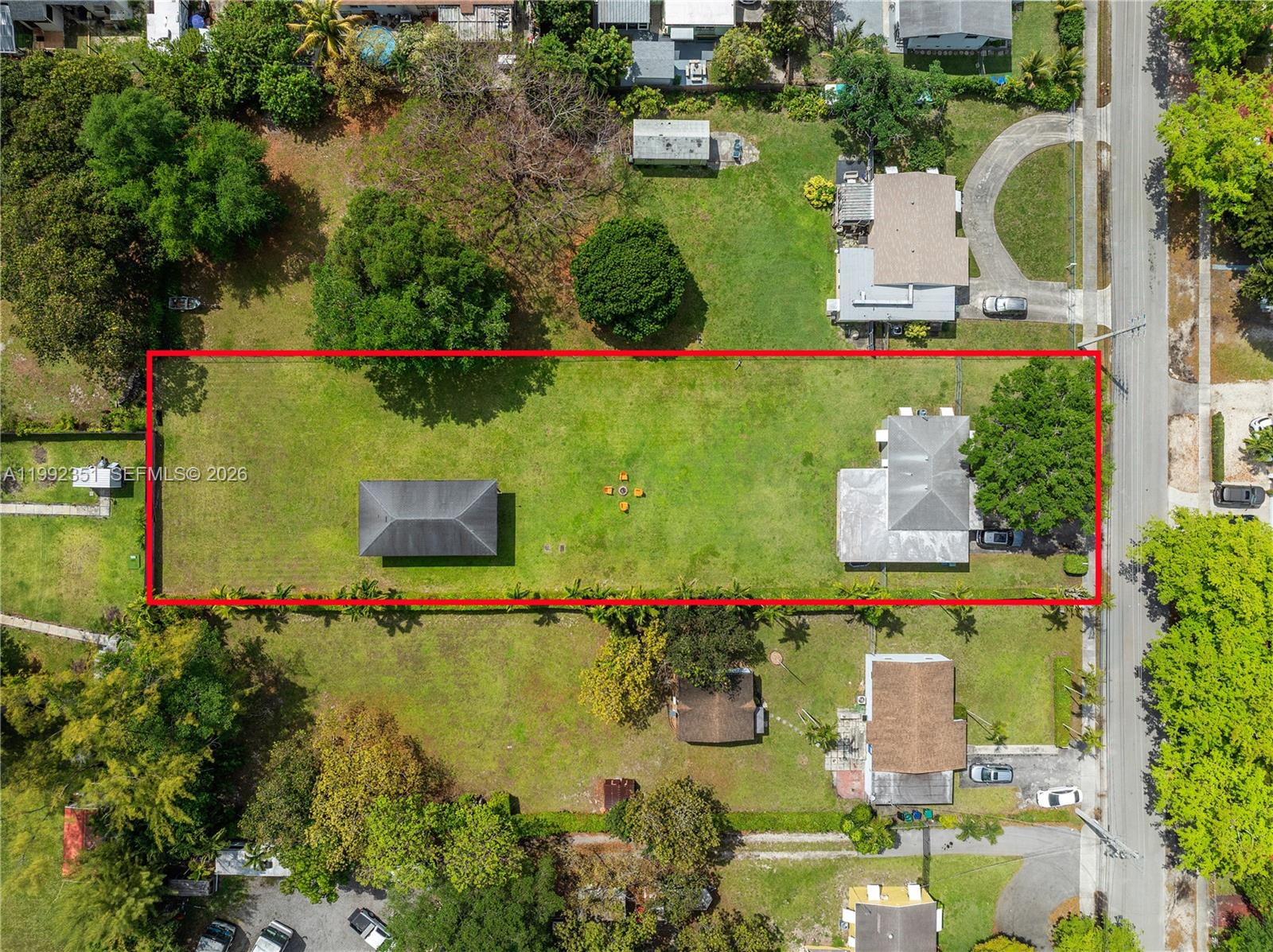 An aerial view shows a rectangular lot containing two detached buildings and a large lawn — 14031 NW 5th Ave, Miami FL 33168, MIAMI, FL