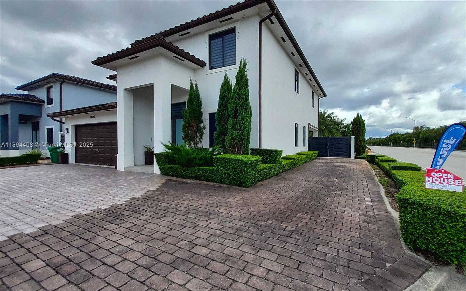 A two-story white house with a brown tile roof and a paved driveway — 14680 SW 17th St, Miami FL 33175, MIAMI, FL