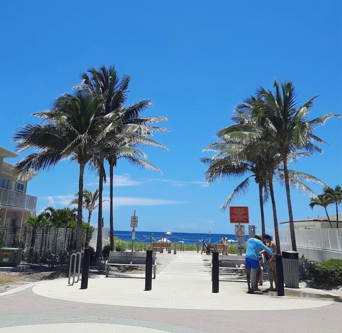 A kitchen featuring dark wood cabinets, stainless steel appliances, and granite countertops — 3208 SE 11th Street # 201, Pompano Beach FL 33062, POMPANO BEACH, FL