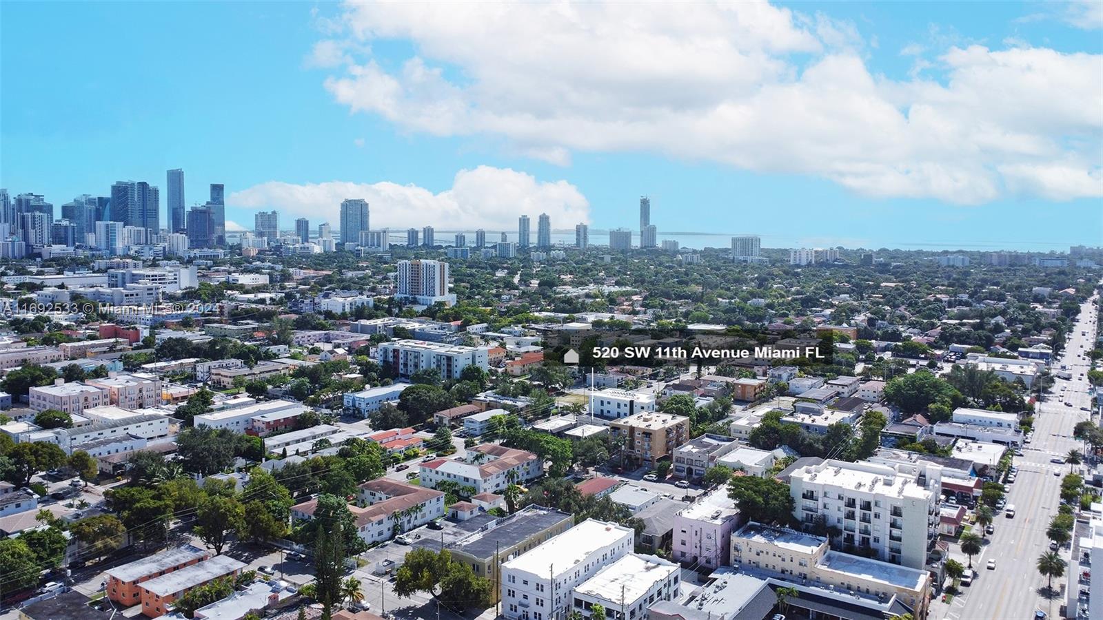 An aerial view shows a dense urban neighborhood with low-rise buildings and a distant skyline — 520 SW 11th Ave, Miami FL 33130, MIAMI, FL