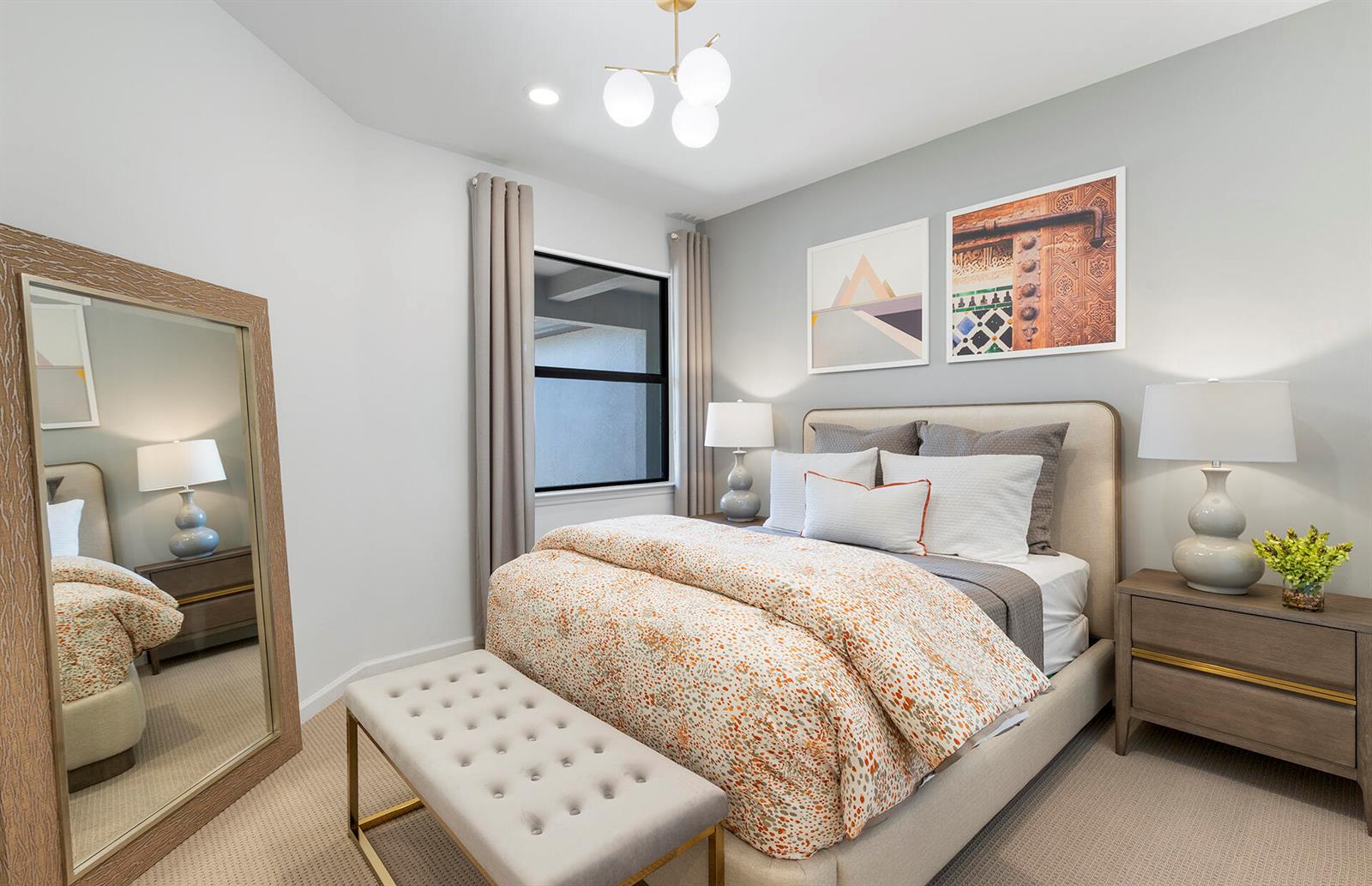A bedroom features a queen bed, a tufted bench, a floor mirror, and two nightstands — 6407 Memorial Lane, Ave Maria FL 34142, AVE MARIA, FL