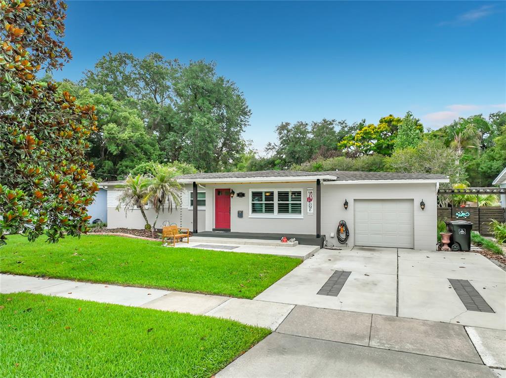 A single-story house with a gray exterior, red front door, and an attached one-car garage — 2806 VINE STREET, ORLANDO, FL