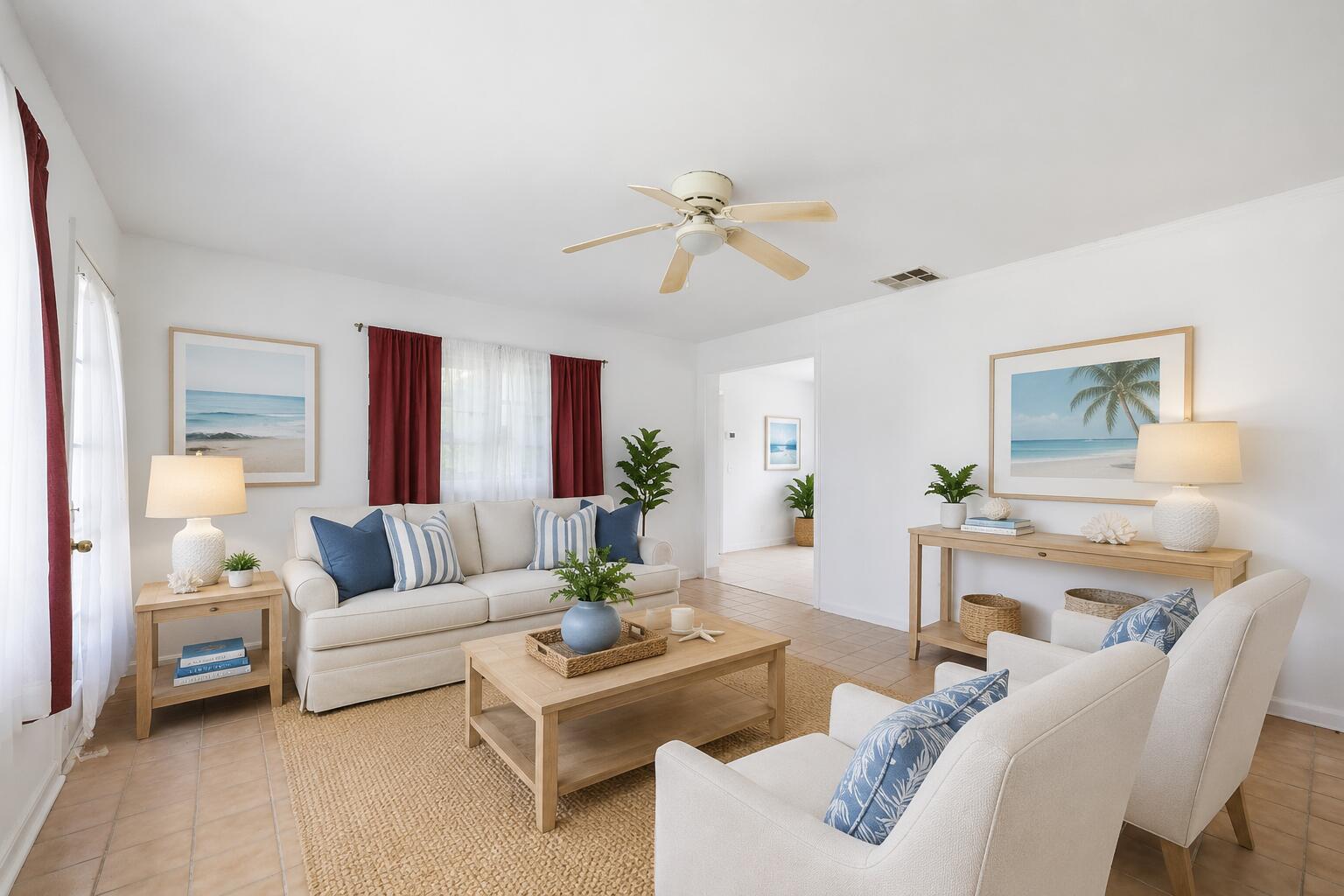 A bright living room features a beige sofa, two armchairs, a coffee table, and coastal decor — 115 SE 11th Avenue, Boynton Beach FL 33435, BOYNTON BEACH, FL