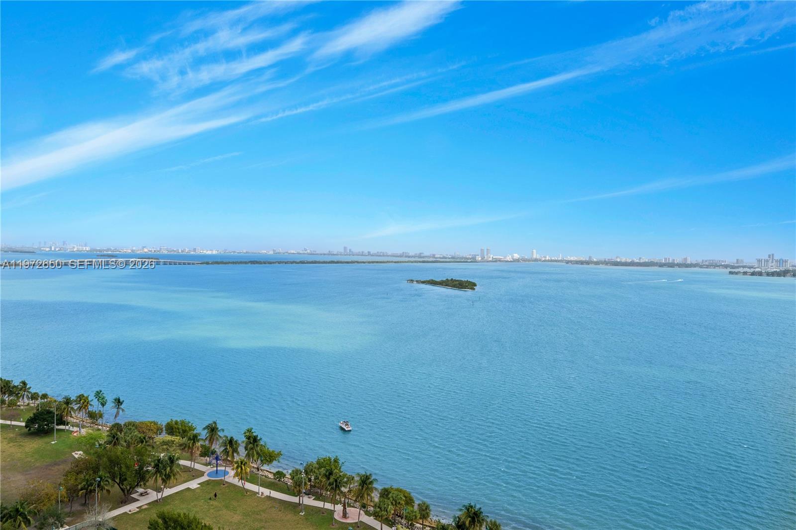 An elevated view of a park, a small boat, and a bay under a blue sky — 488 NE 18th St # 2112, Miami FL 33132, MIAMI, FL