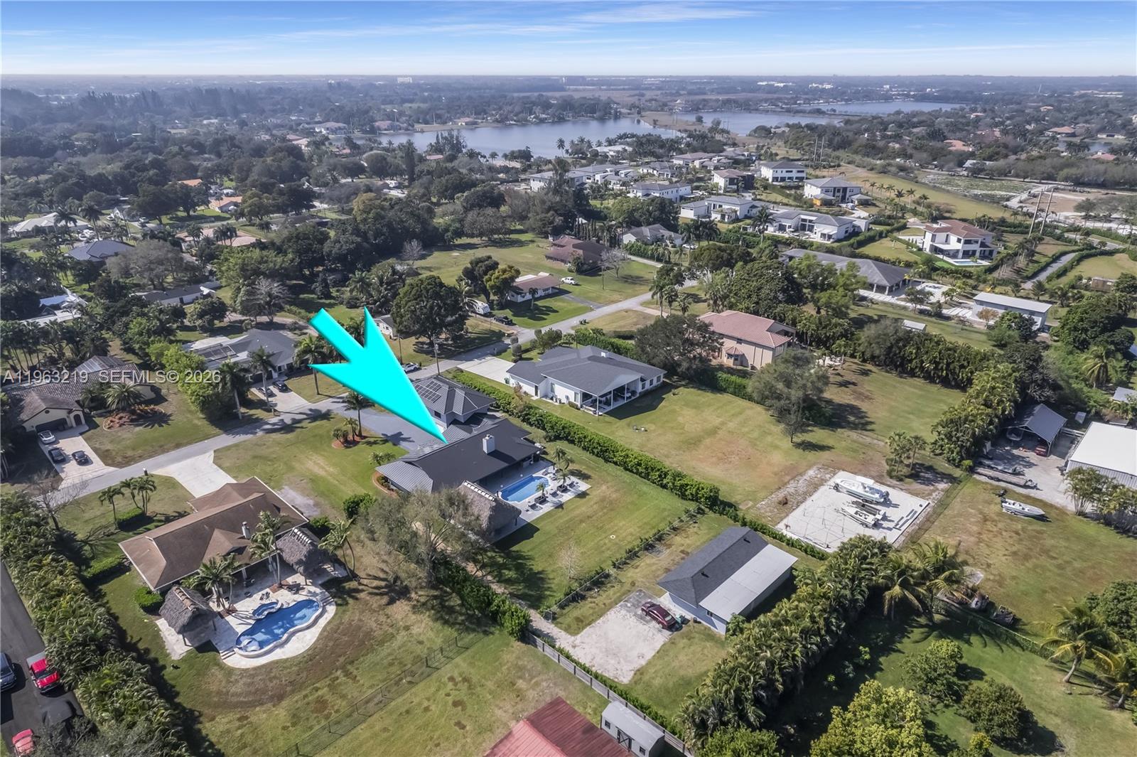 An aerial view shows a residential property with a swimming pool and a detached garage — 14651 SW 16th St, Davie FL 33325, DAVIE, FL