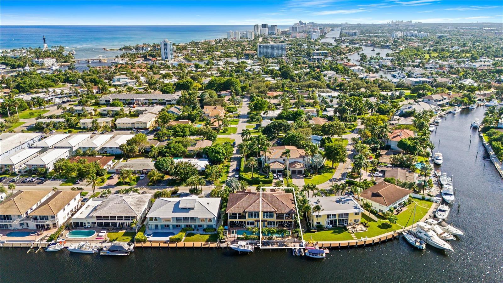 An aerial view of a waterfront house with a pool and boat dock in Florida — 2637 NE 28th Court, Lighthouse Point FL 33064, LIGHTHOUSE POINT, FL