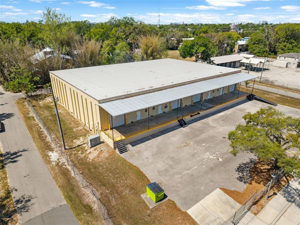 An aerial view of a rectangular warehouse building with a loading dock and parking lot — 1030 SE 4TH STREET, GAINESVILLE, FL