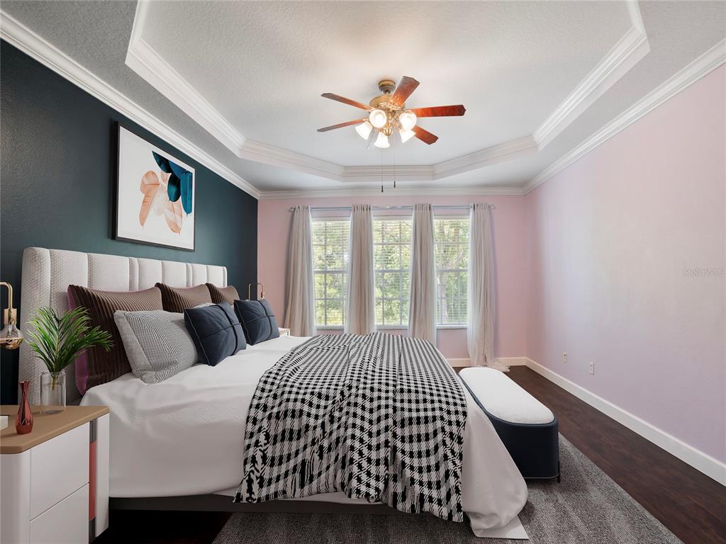 A dining area features a round marble table, four upholstered chairs, and a chandelier — 19111 LAKE AUDUBON DRIVE, TAMPA, FL