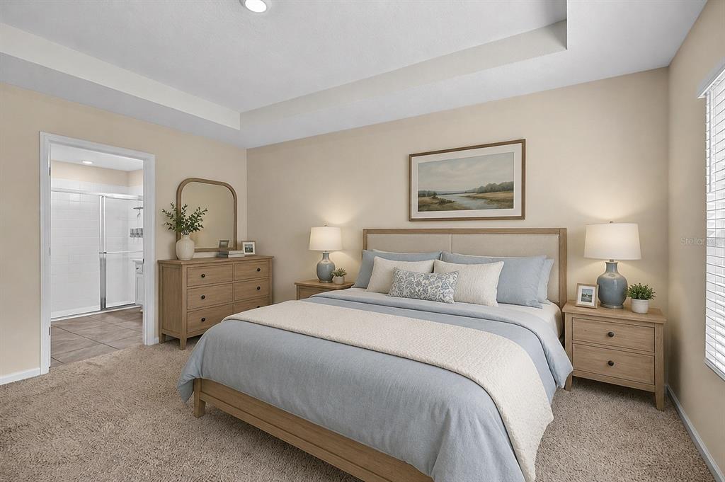 A bedroom features a bed with light blue bedding, two nightstands, and an attached bathroom — 97 RIVERTOWN ROAD, PALM COAST, FL