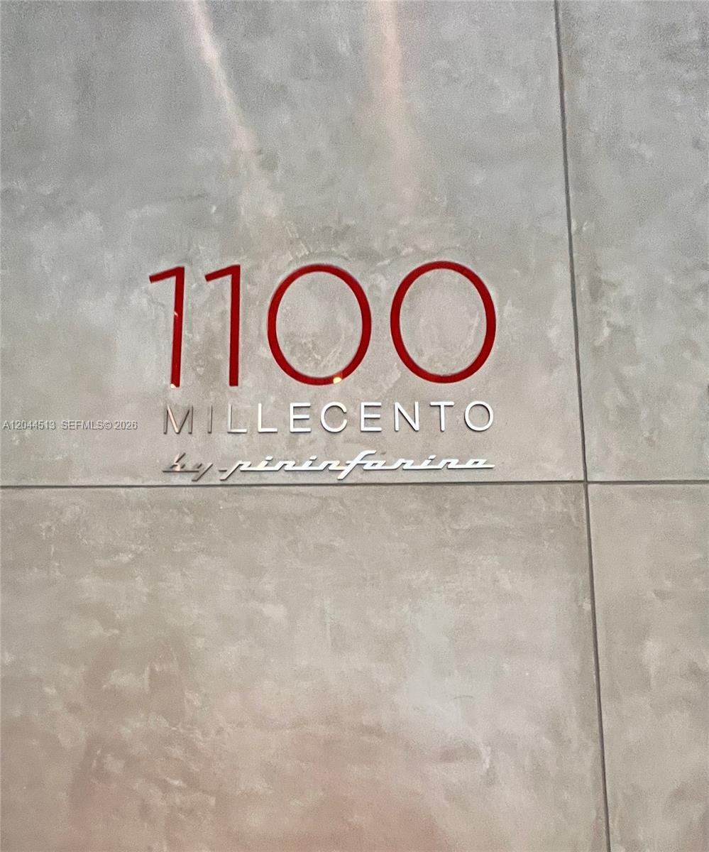 The image shows a wall sign for Millecento by Pininfarina with the number 1100 — 1100 S Miami Ave # 2002, Miami FL 33130, MIAMI, FL