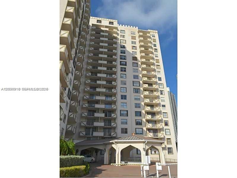 A tall, multi-story residential building with balconies and a covered entrance at the base — 1865 S Ocean Dr # 11L, Hallandale Beach FL 33009, HALLANDALE BEACH, FL