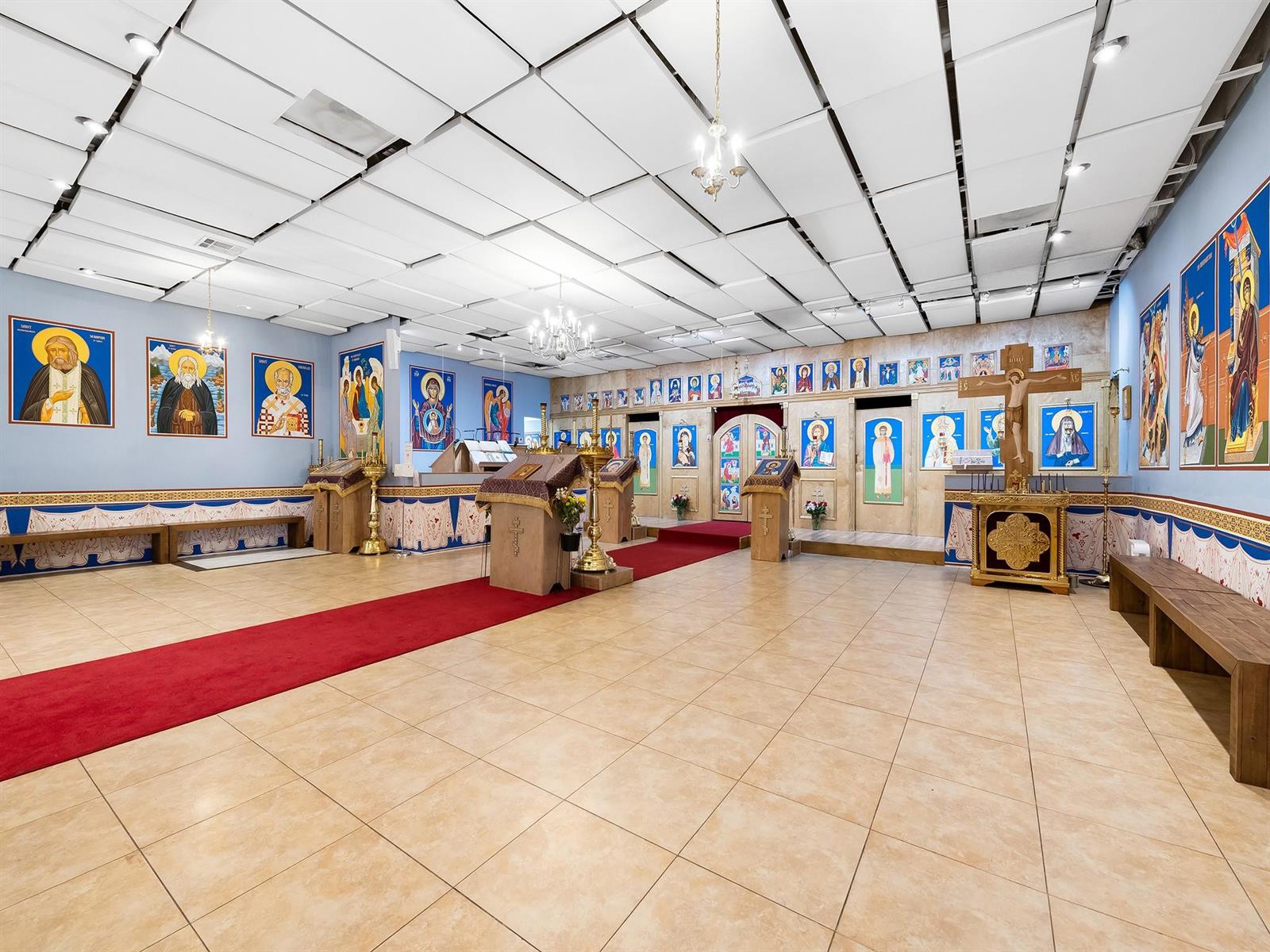An Orthodox church interior features a red carpet, tiled floors, and walls adorned with religious icons — 1301 E Atlantic Boulevard Suite 5, Pompano Beach FL 33060, POMPANO BEACH, FL