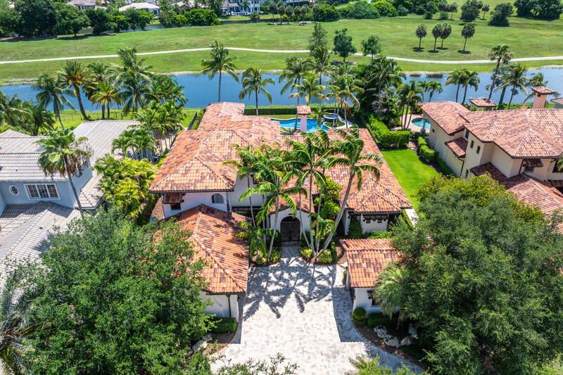 An aerial view shows a large Mediterranean-style house with a tiled roof and swimming pool — 6680 NW 122nd Avenue, Parkland FL 33076, PARKLAND, FL