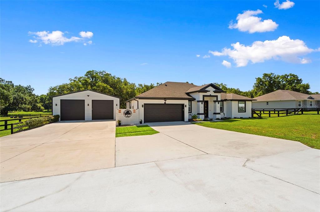 A single-story house with a two-car garage and a detached two-car garage — 437 GANDY CEMETERY ROAD, BARTOW, FL
