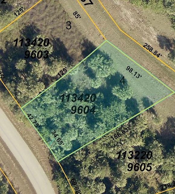 This is an aerial map view of a vacant, wooded residential lot — LOT: 4 EASTMAN CIRCLE, NORTH PORT, FL